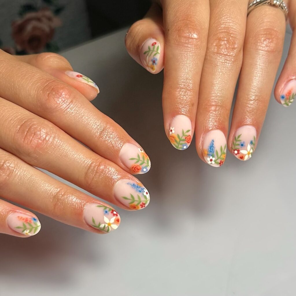 Almond Nails with Matte Finish and Tiny Colorful Florals for a Romantic Garden Feel