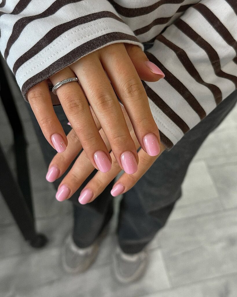 Almond Bubblegum Pink Nails With a Hint of Sparkle for Feminine Charm