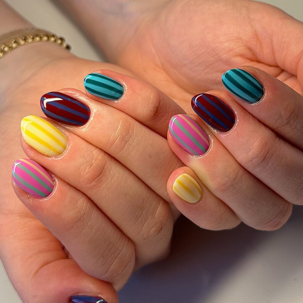 Almond nails with colorful stripes simple summer nail ideas with glossy finish