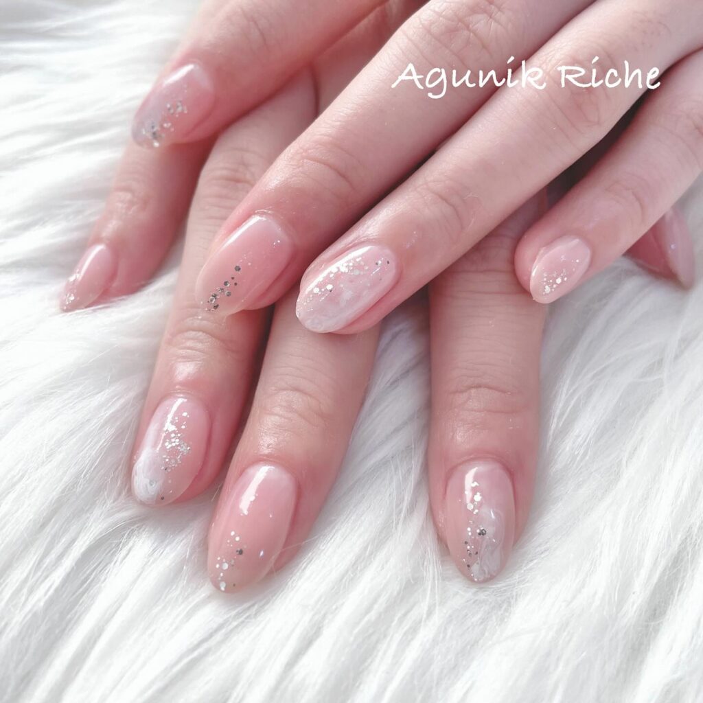 Almond Nails with Sheer Pink Base and Marble Glitter Accents – Graceful Nail Ideas for Work