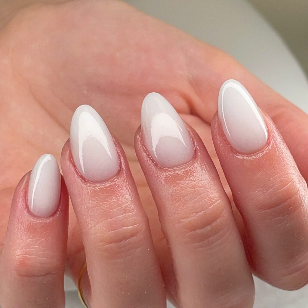 Almond Ombré Nails with Milky White Tips for a Soft Gradient Look