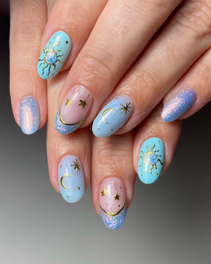Almond Pastel Blue Celestial Nails with Glitter Tips and Gold Star Art – Short Summer Nail Ideas