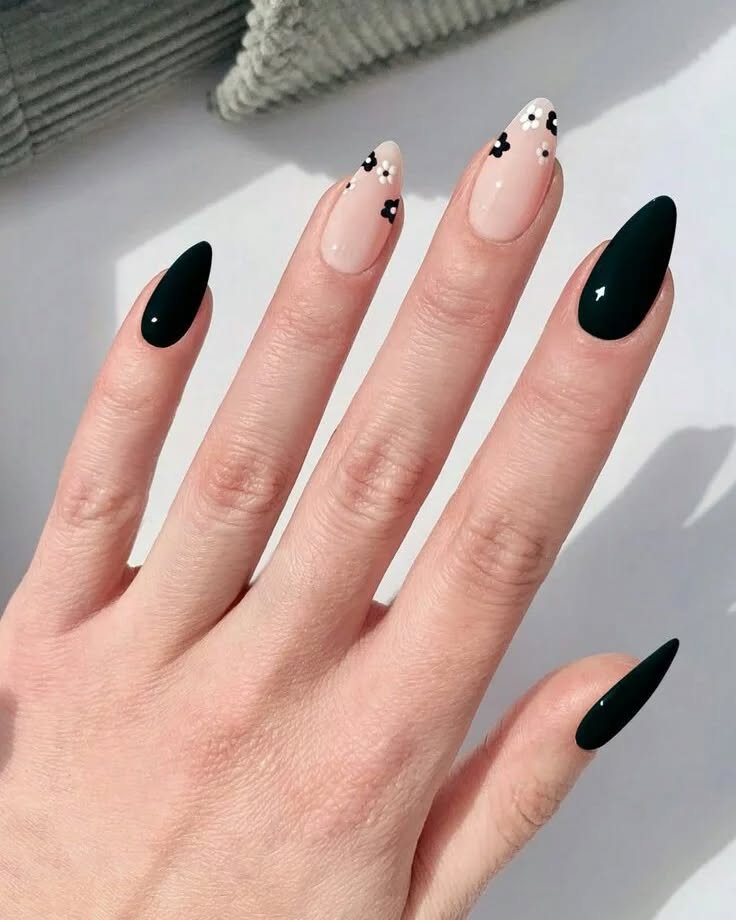 Black Almond Nails with Delicate Floral Accents on Nude Base