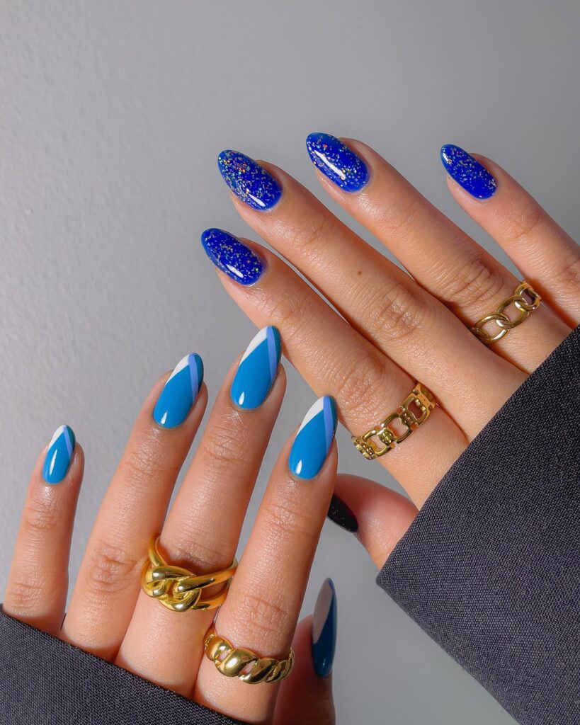 Bold Cobalt Glitter and Sky-Blue Nails with White Diagonal Tips for a Vibrant and Trendy Graduation Look