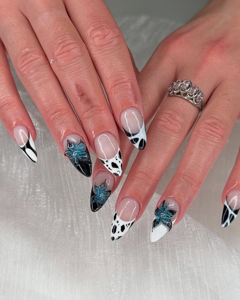 Bold Black and White Stiletto Nails with Dalmatian Spots and 3D Florals