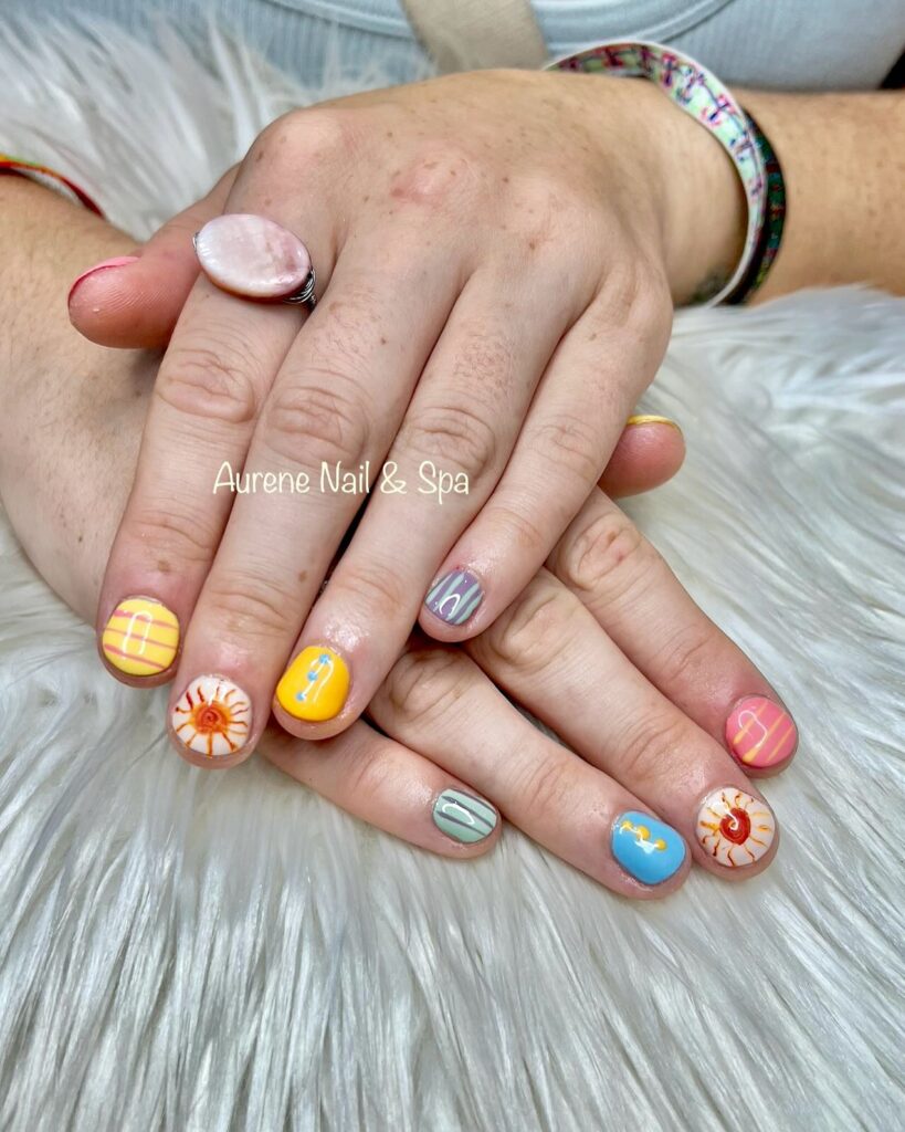 Bright Mix-and-Match Beach Nails with Flip-Flops, Suns, and Stripes for Summer Fun