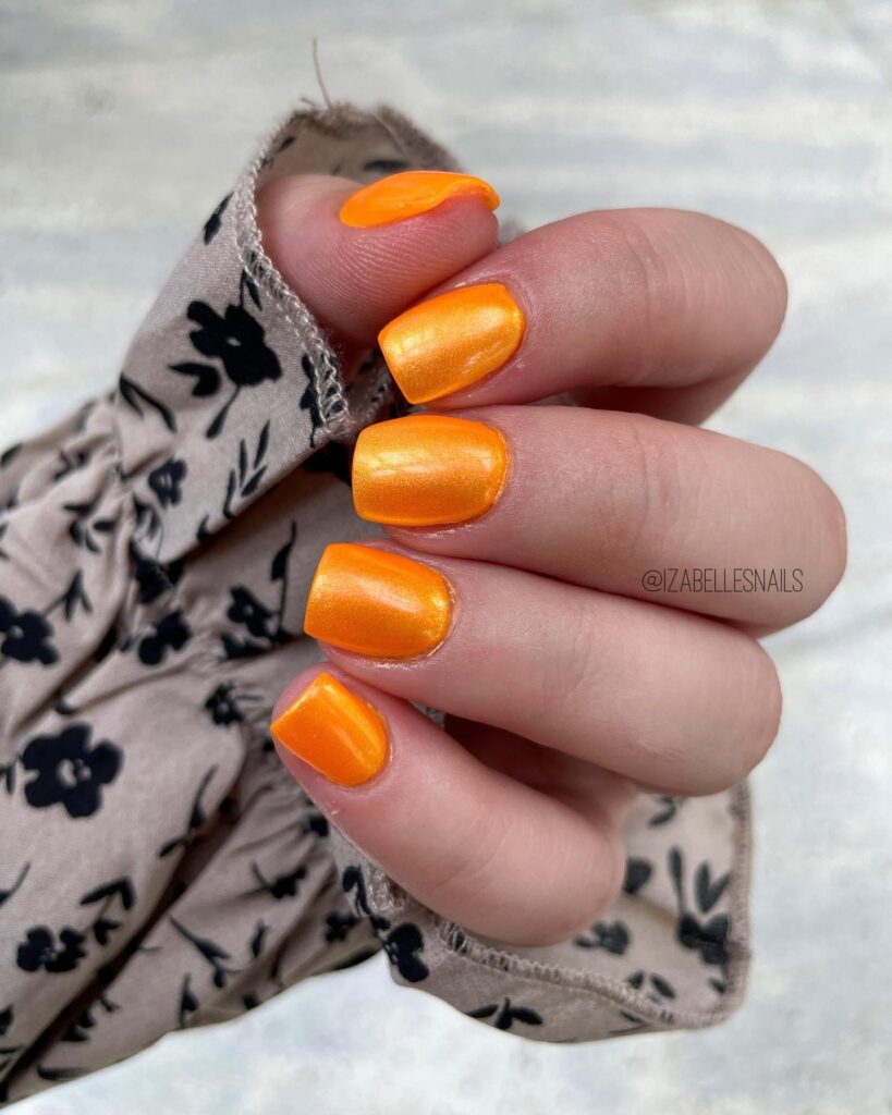Bright orange square nails with a metallic shine – bold summer graduation nail ideas