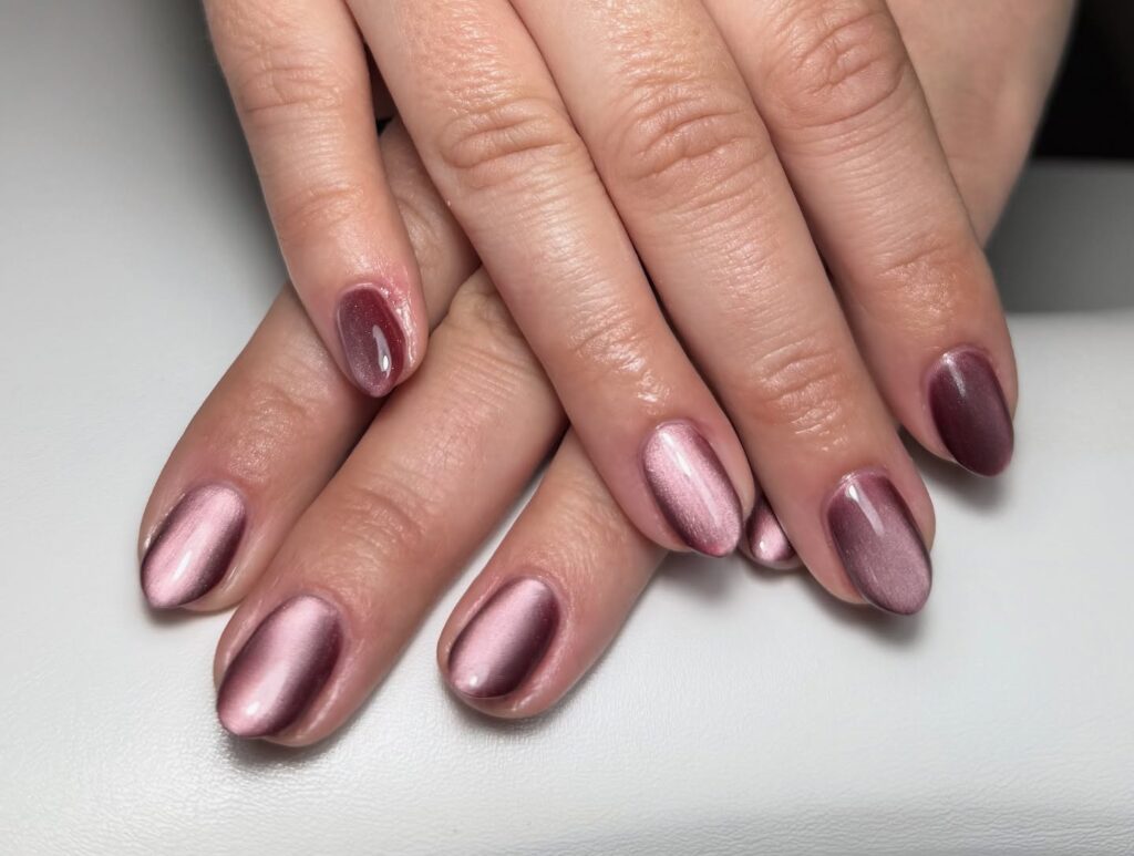Cat eye oval nails with rose and mauve magnetic polish for a luxurious evening nail design