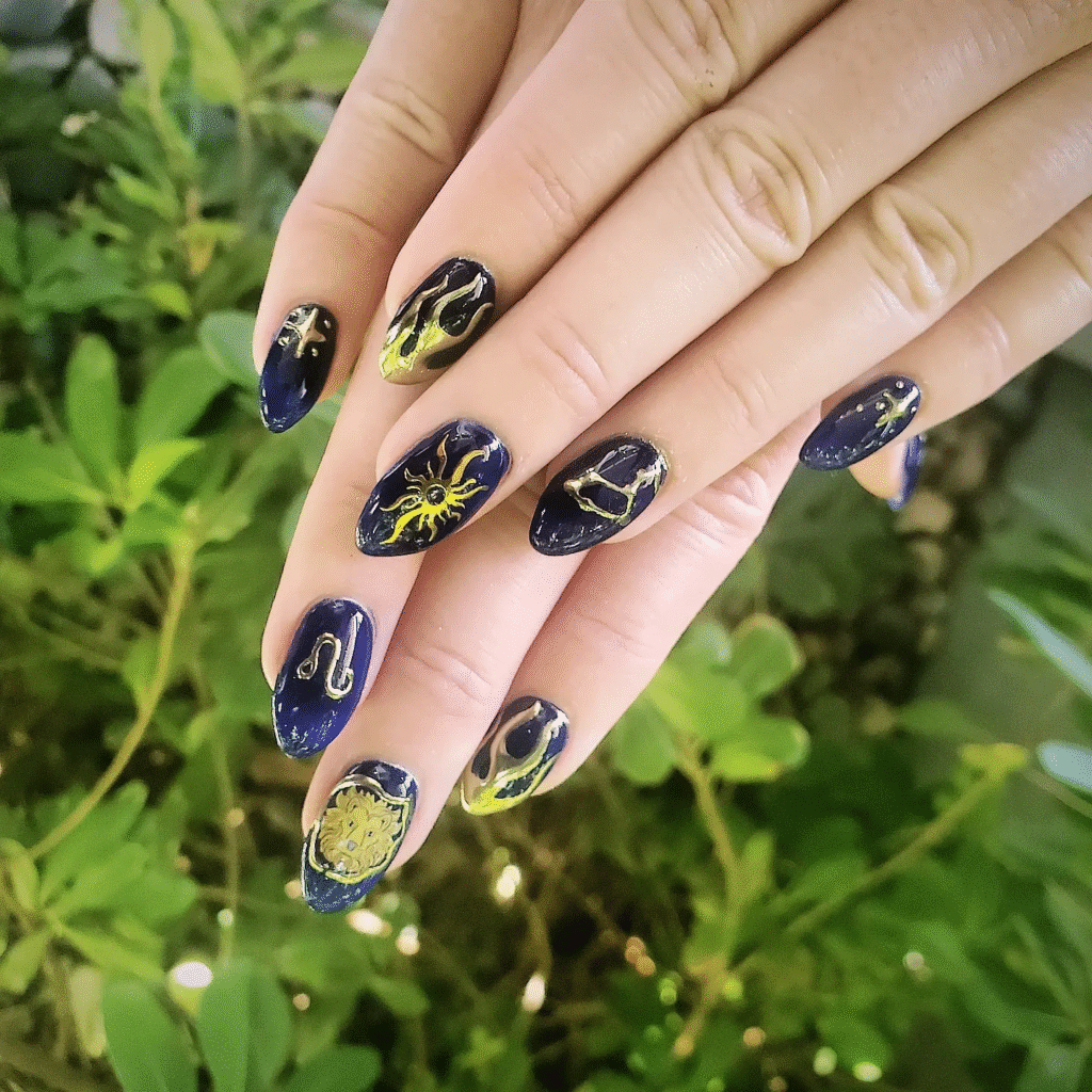 Celestial Almond Nail Ideas with Gold Zodiac Art on Navy Polish