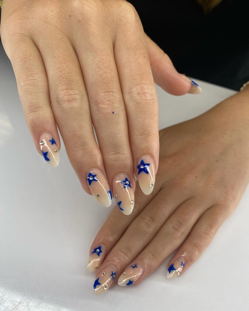 Celestial Nude and Cobalt Blue Star Almond Nails – Trendy Cosmic Graduation Nail Ideas