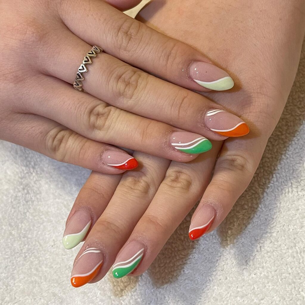 Colorful French Tips on Almond Nails with Wavy Line Art for a Fun Birthday Vibe
