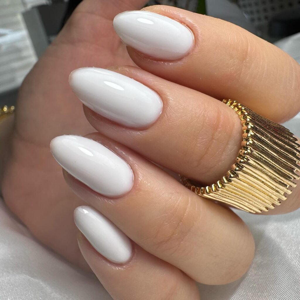 Creamy White Almond Nails for a Sleek and Polished Finish