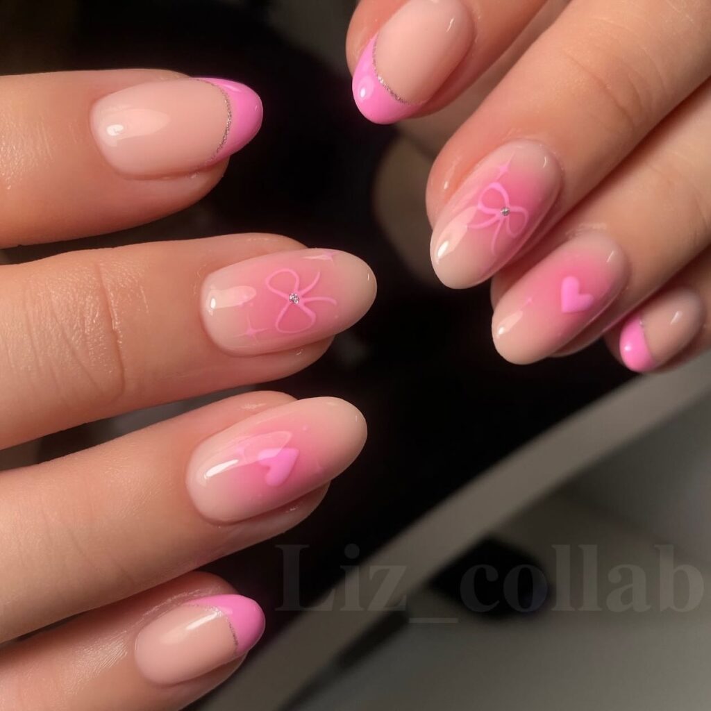 Cute Pink French Oval Nails with Glitter, Hearts, and Bows