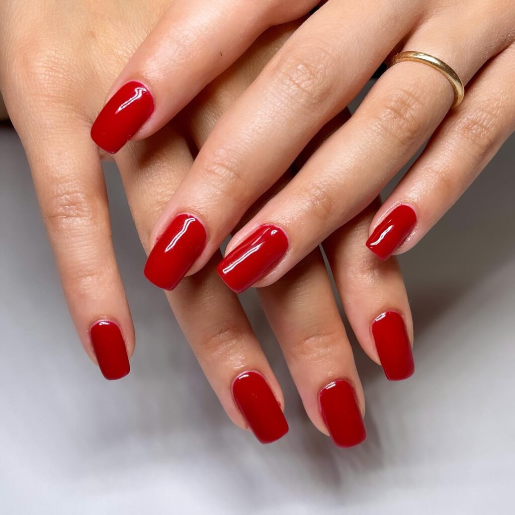 Deep red square nails in a classic shape for effortless style and sophistication