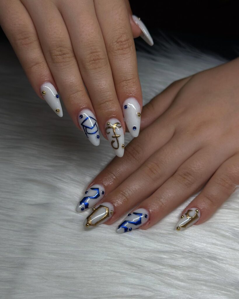 Elegant Almond-Shaped Nails with Shimmering White Base and Blue Gold Graduation Accents