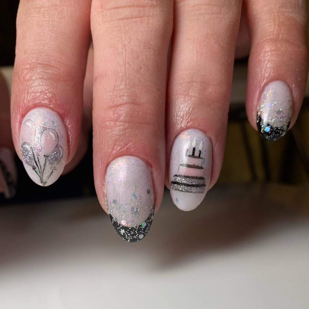 Elegant Oval Birthday Nails with Glitter French Tips and Cake Art Accents