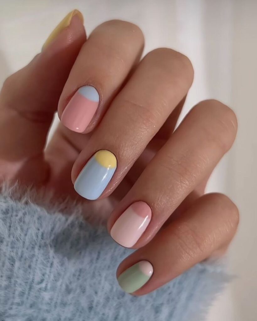Geometric pastel nails with baby blue blush pink and mint green shades for a modern retro spring style
