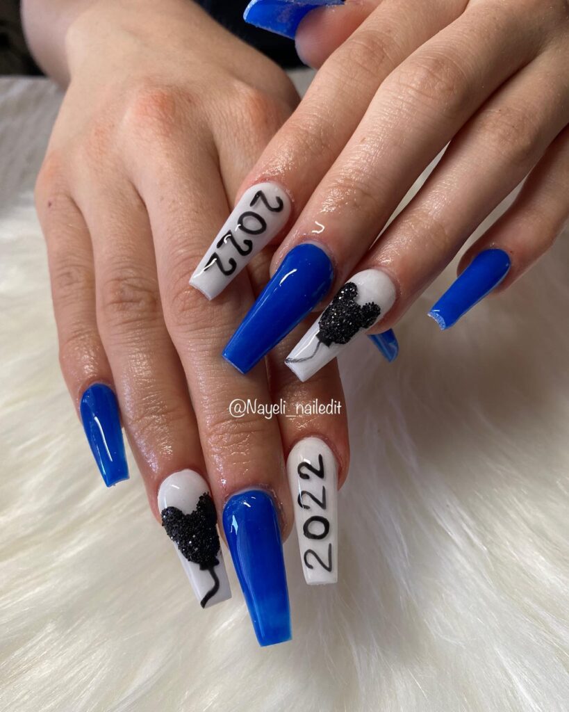 Glossy Royal Blue Coffin Nails with White Accent Nails Featuring Graduation Year and Mickey Balloon Art