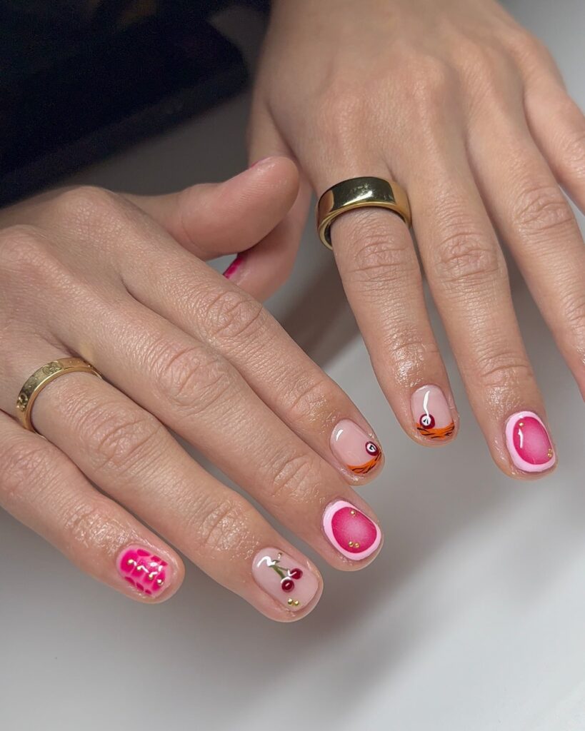 Glossy Short Round Nail Ideas with Cherries, Abstract Swirls, and Fruit Art for a Summer Pop