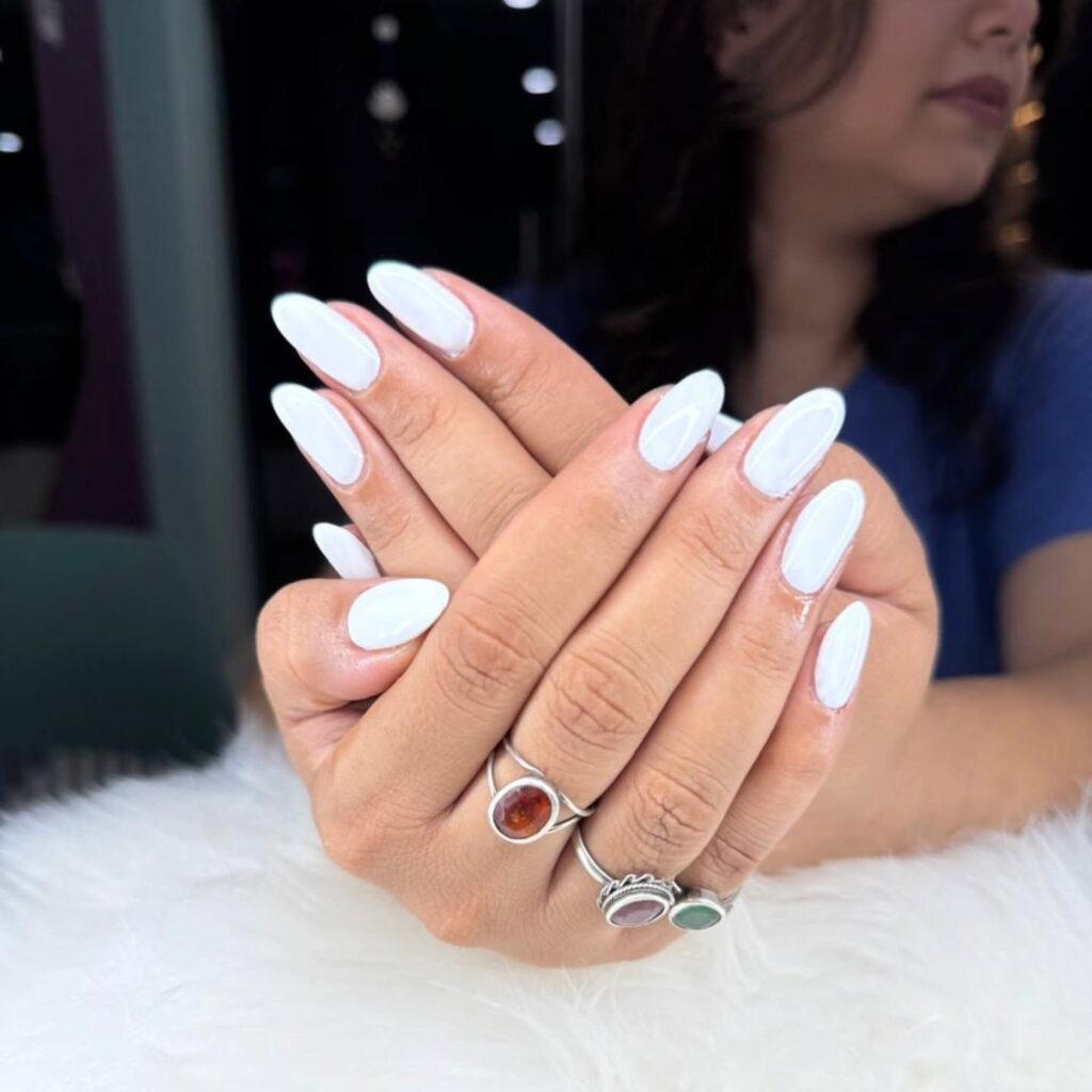 Glossy White Almond Nails with Sleek Minimalist Vibe