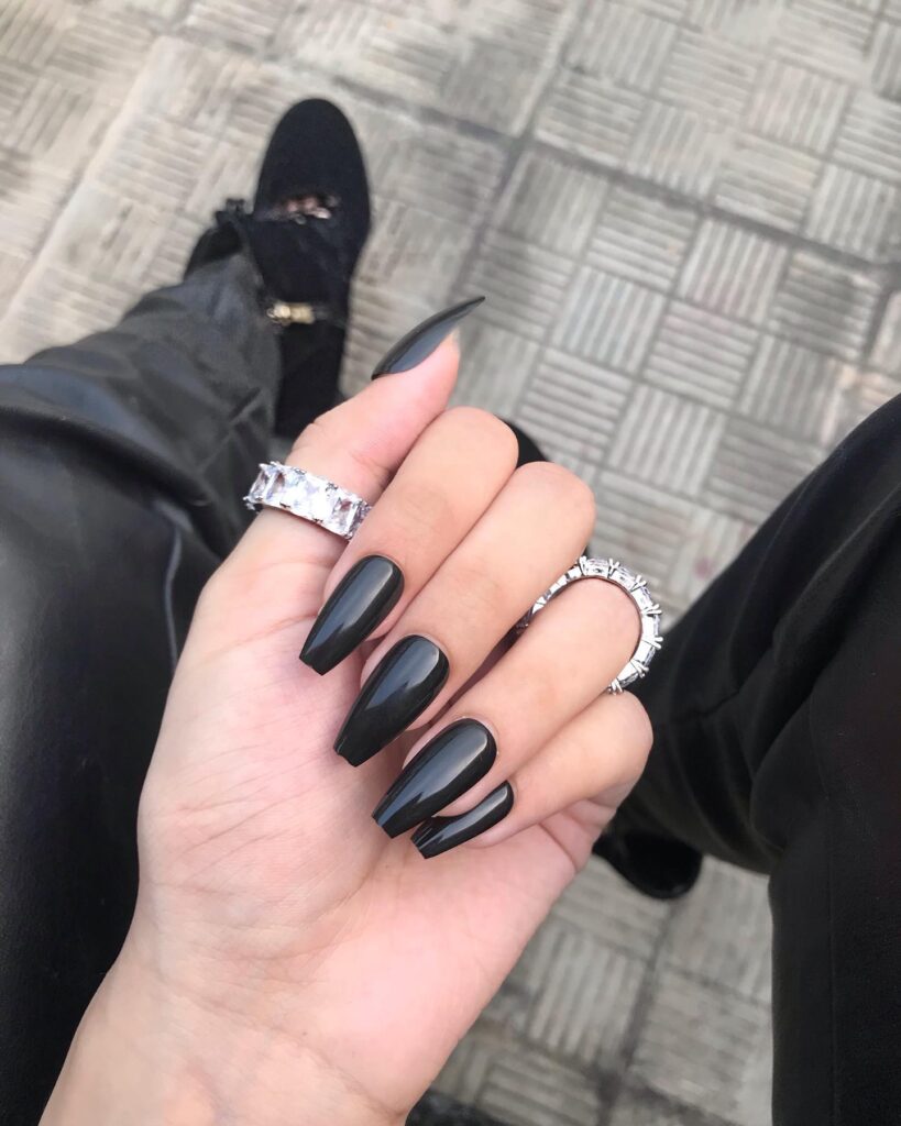 High-Shine Coffin Nails with Black Polish for an Elegant Monochrome Manicure