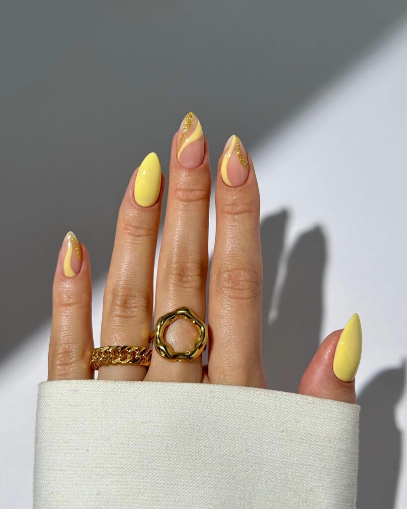 Lemon Yellow and Gold Swirl Almond Nails for a Bold Summer Statement