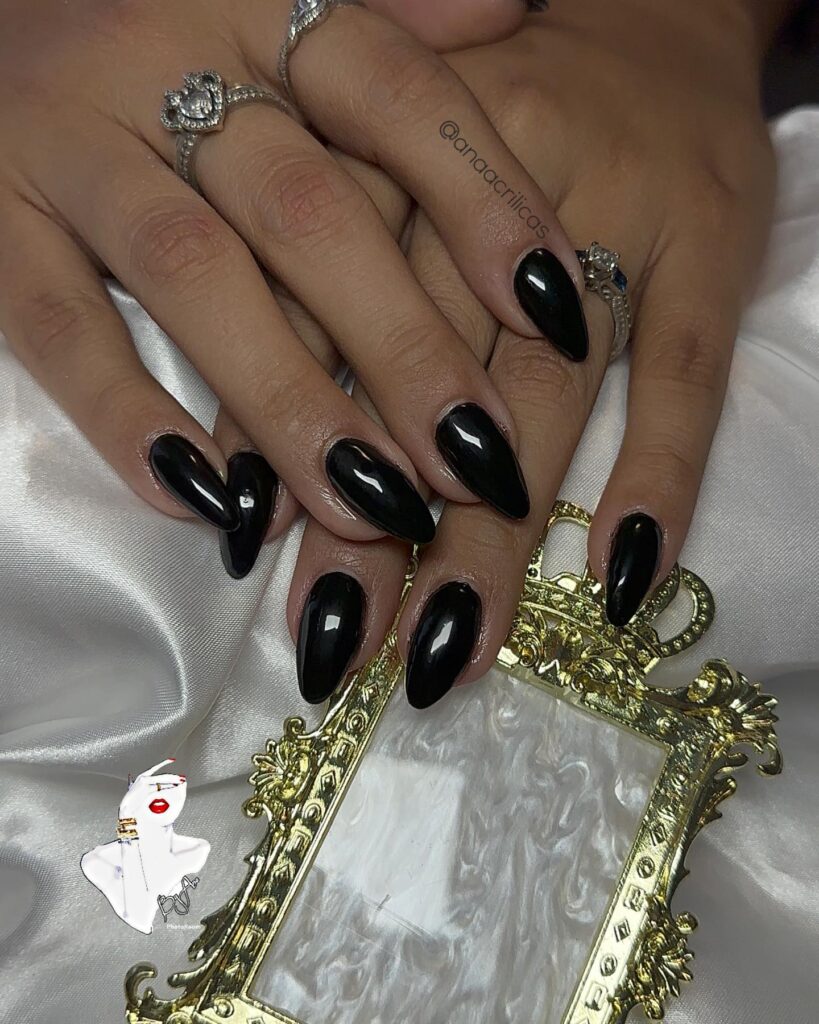 Long Almond Jet Black Nails with a High-Gloss Glam Finish