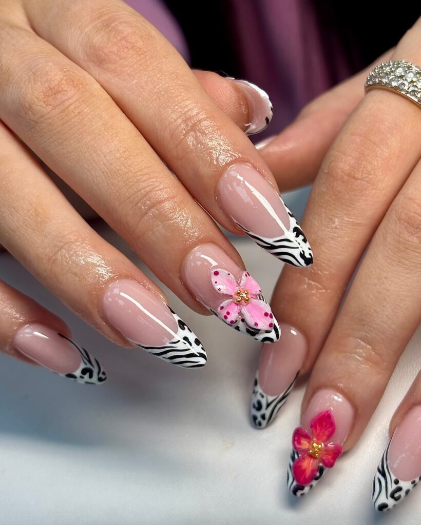 Long Almond Zebra Print French Tip Nails with Nude Base and 3D Pink and Red Floral Accents for Bold Birthday Nails