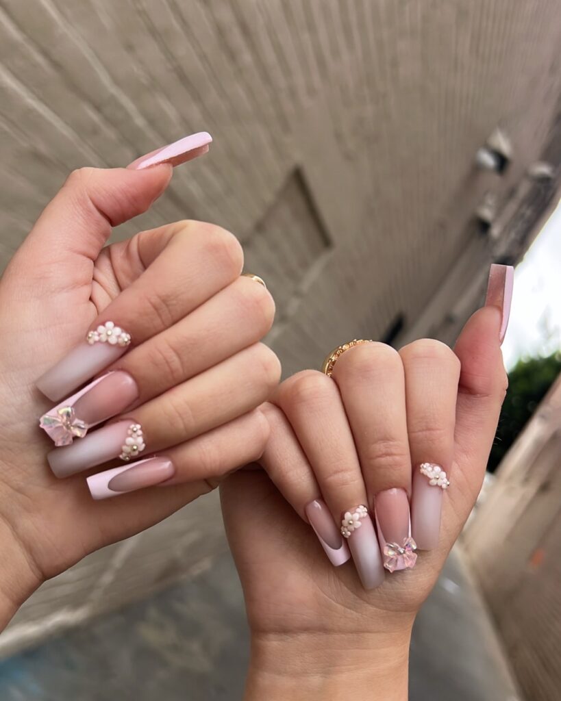 Long square nude ombre nails with 3d pearls and flowers – elegant nail ideas for graduation ceremonies