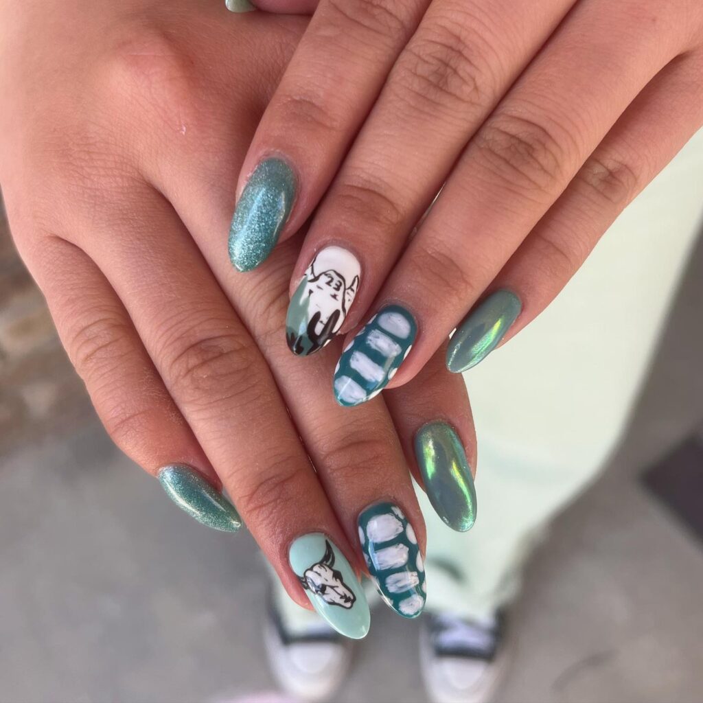 Medium Almond Metallic Green Nails with Edgy Skull and Teeth Art for a Glamorous Alternative Graduation Style