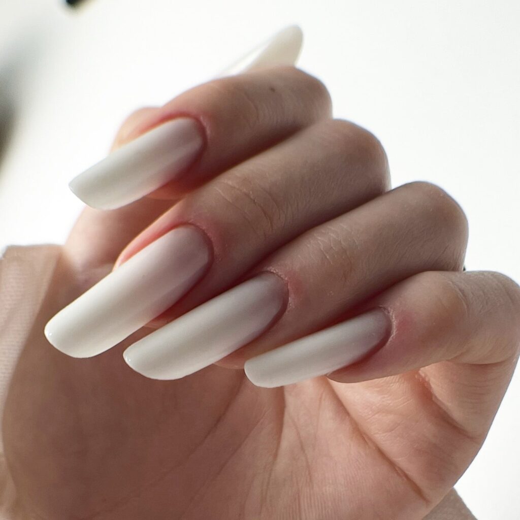 Milky White Coffin Nails with Glossy Finish – Minimalist White Nail Ideas for Formal Events