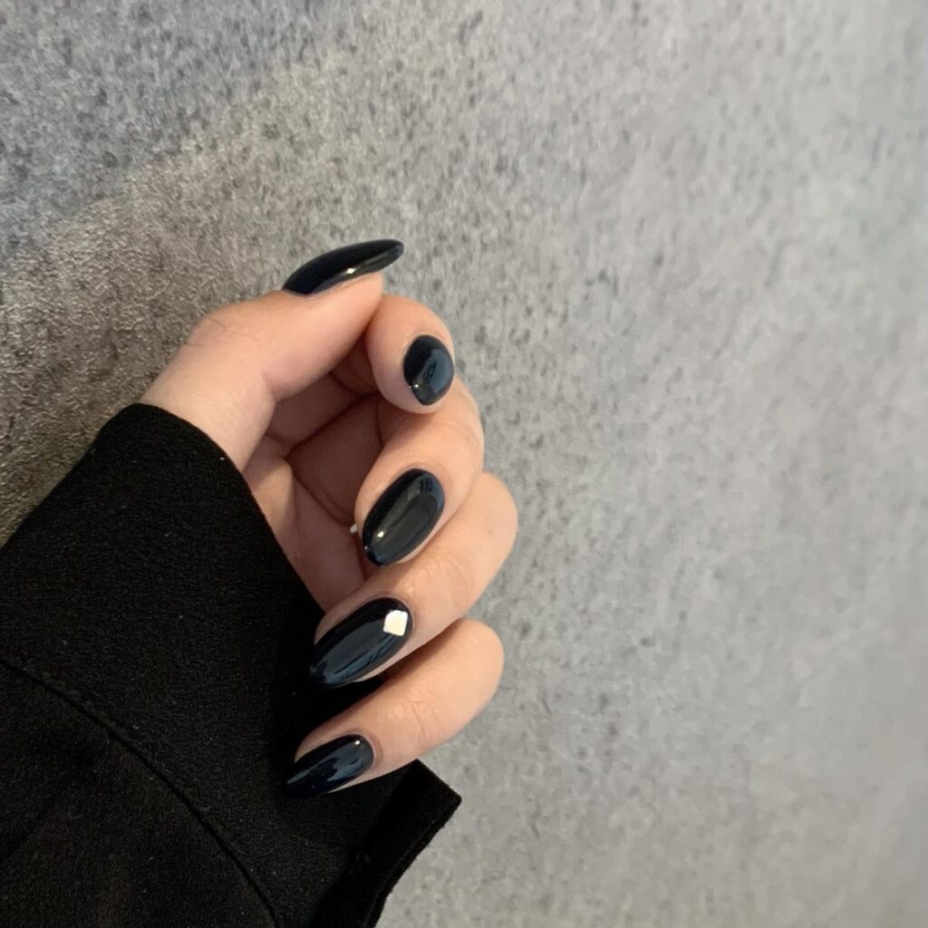 Minimalist Almond Black Nails with Silver Studs – Sleek and Modern Nail Ideas