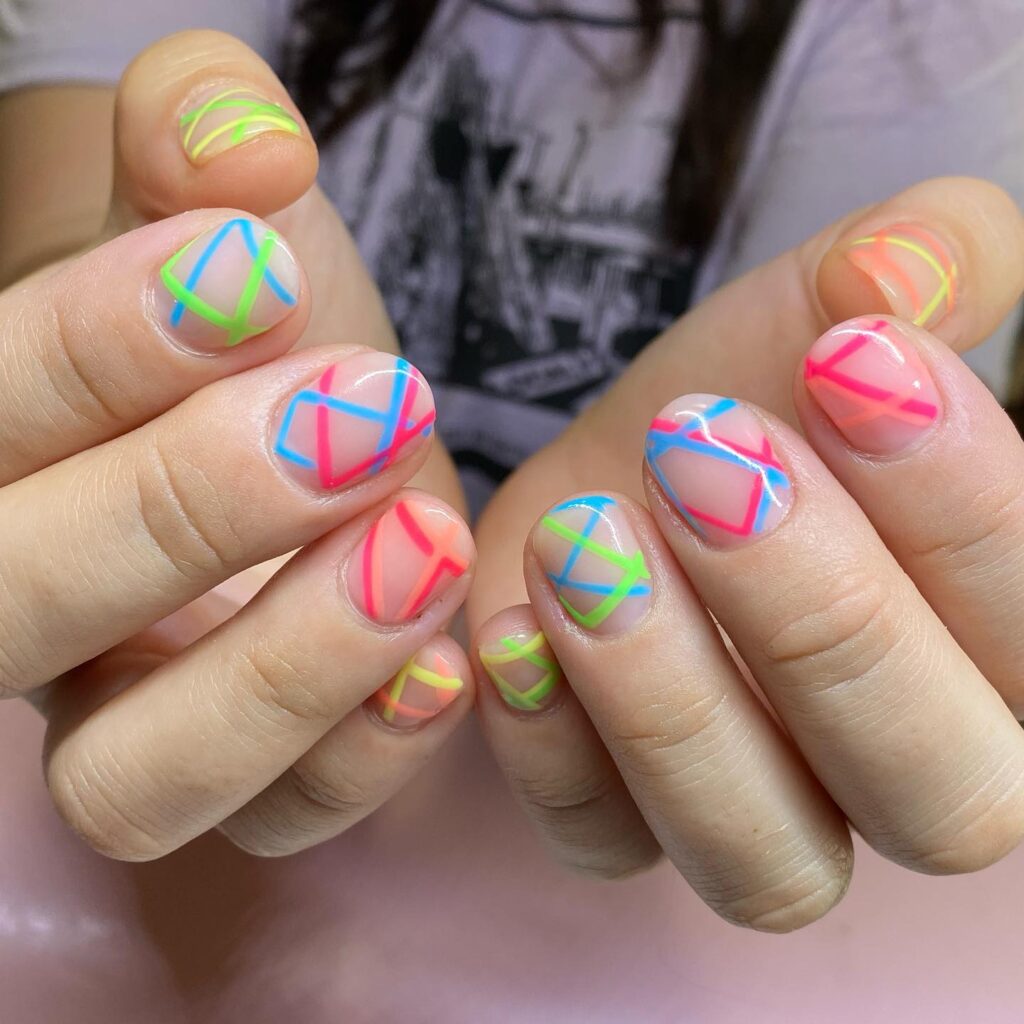Neon Geometric Nail Art on Rounded Tips – Bold and Colorful Short Nail Ideas for Summer