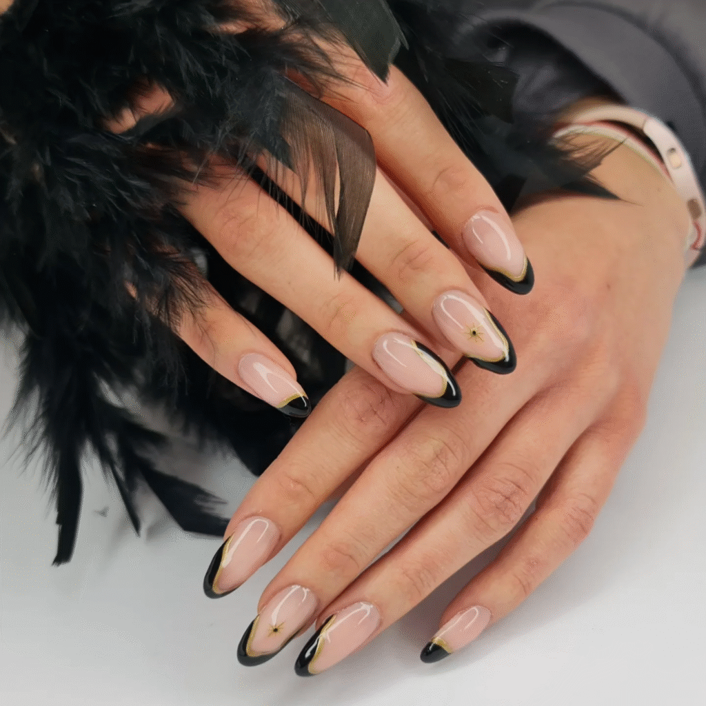 Nude and Black French Tip Nails with Gold Detail – Celestial Almond Nail Idea for Evening Elegance