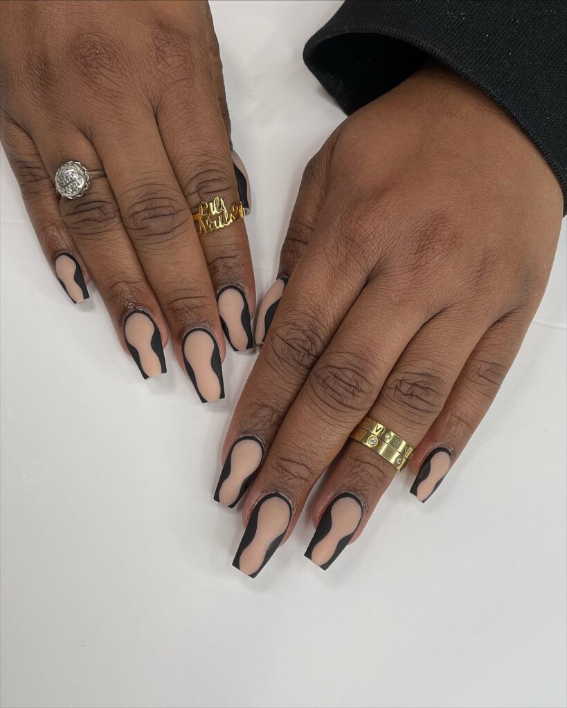 Nude matte square nails with black wavy frames edgy nail ideas for a minimalist statement