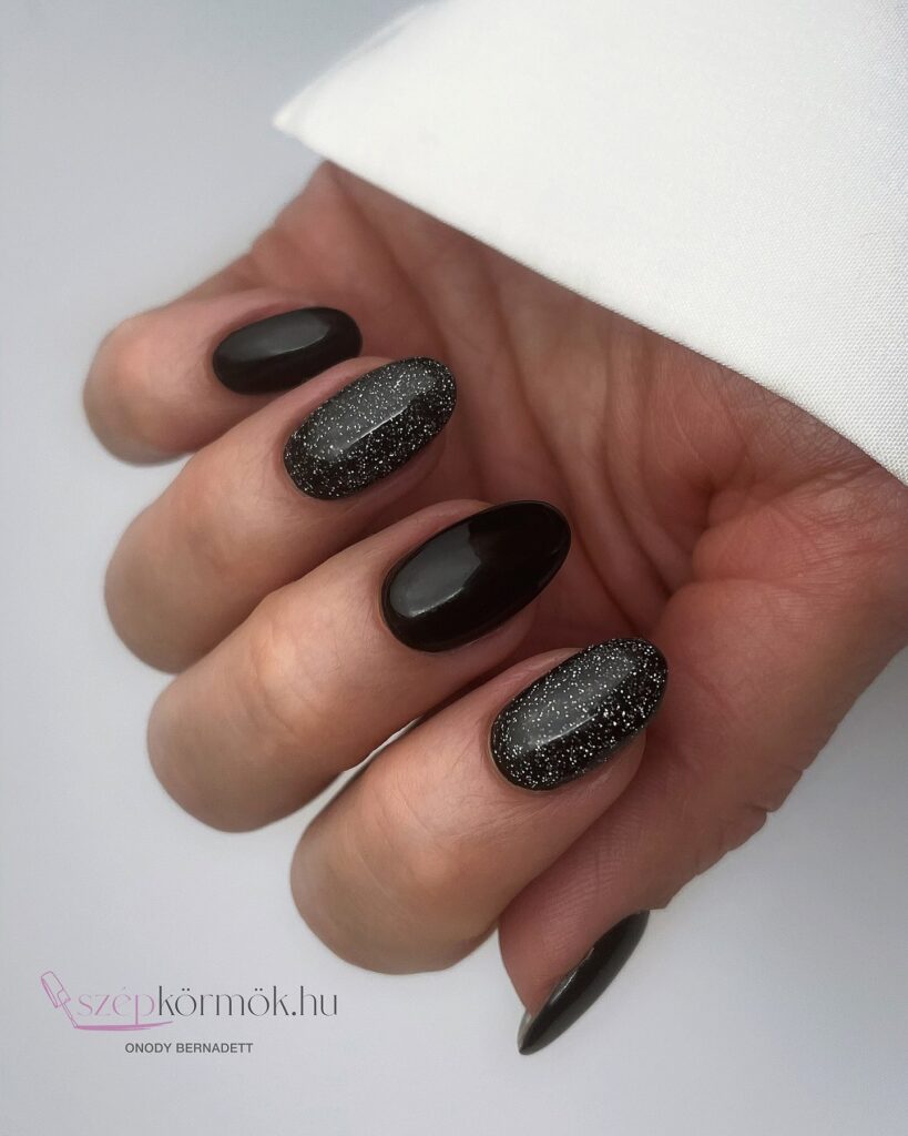 Oval Black Nails with Silver Glitter Accents for a Starry Night-Inspired Design