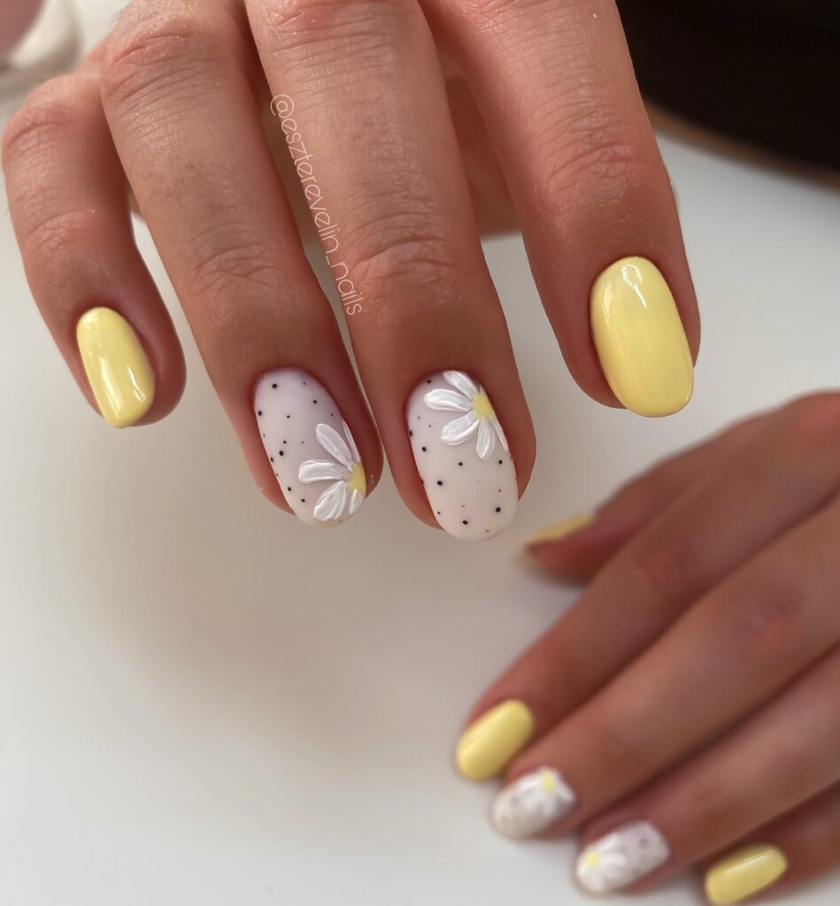 Pastel Yellow Oval Nails with Dainty Daisies for a Fresh Spring Vibe