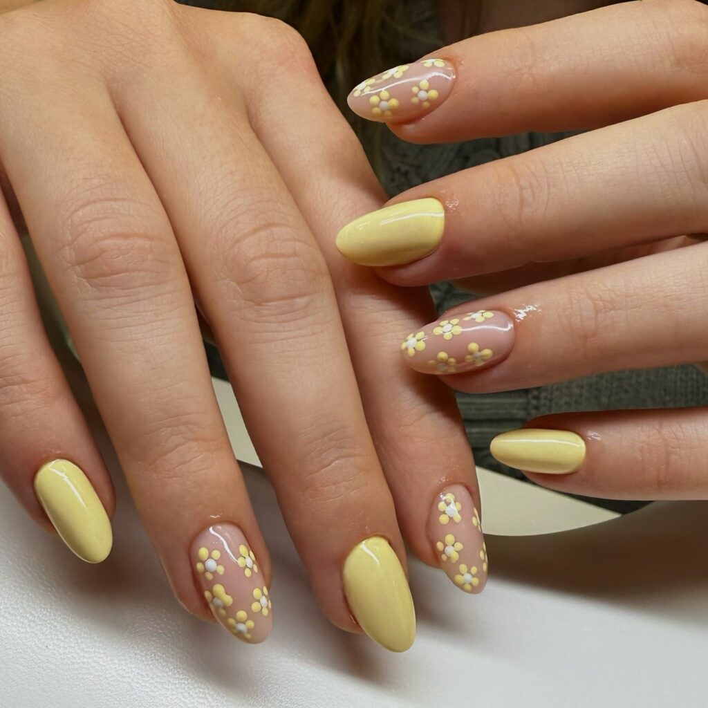 Pastel Yellow and Nude Almond Nails with Tiny Daisy Clusters
