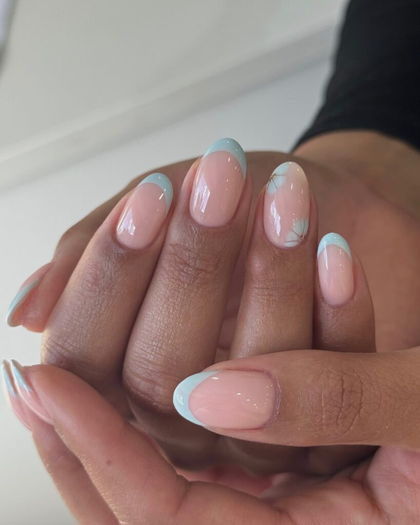 Pastel Blue French Tips on Oval Nails – Minimalist Spring Nail Ideas with Marble Detail