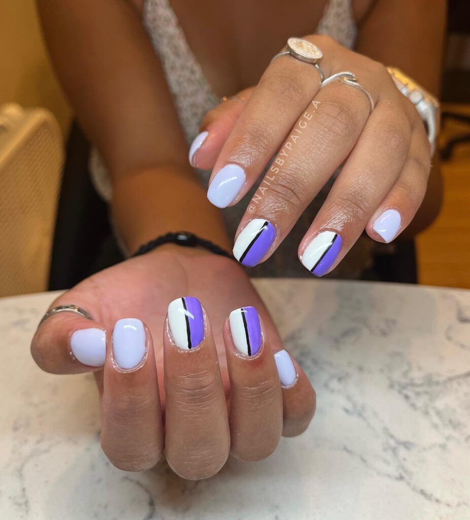 Pastel lavender short nails with color block design – minimalist graduation nail ideas