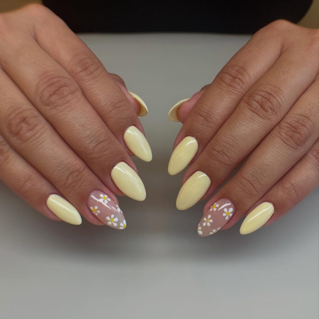 Pastel Yellow Almond Nails with Daisies for a Cheerful Spring Nail Idea