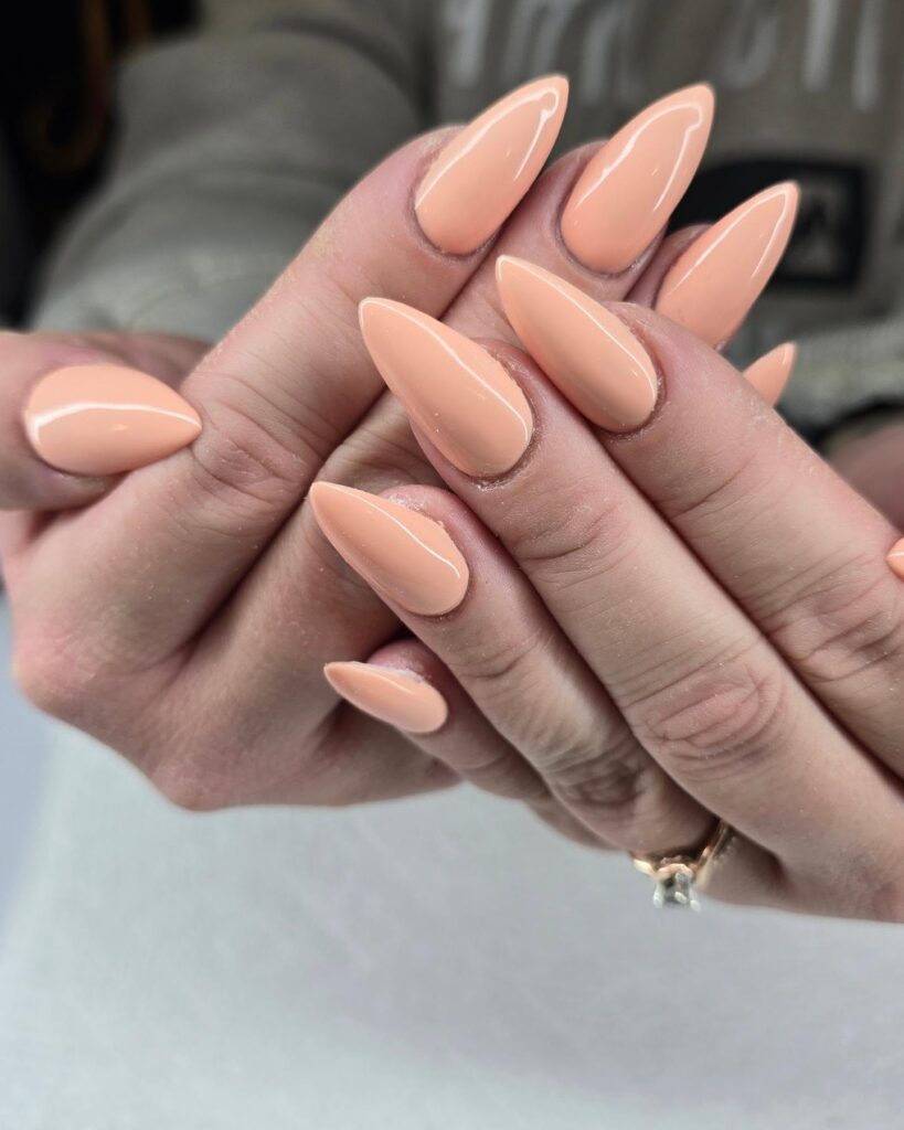 Peachy Nude Almond Nails with Glossy Finish – Chic and Minimal Nail Ideas for Workwear
