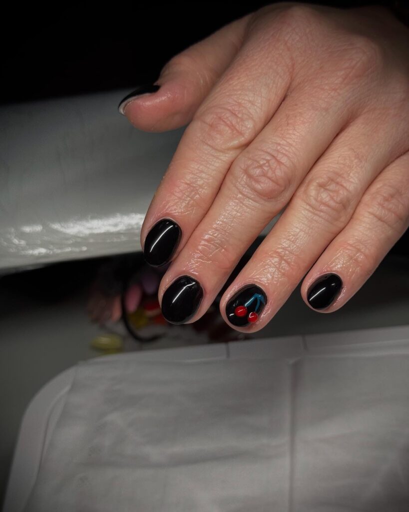 Playful Cherry Accent on Short Black Nails for a Fun Twist on Minimalism