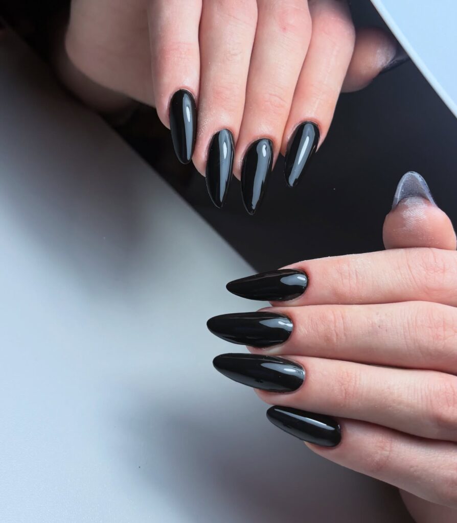 Polished Black Almond Nails for a Bold Look – Edgy and Confident Nail Ideas