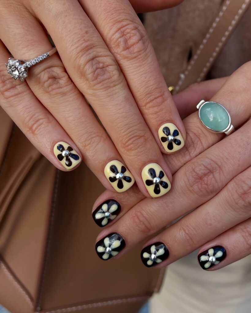 Retro Yellow and Black Floral Short Nails with Metallic Accents – Funky ’60s Summer Nail Look