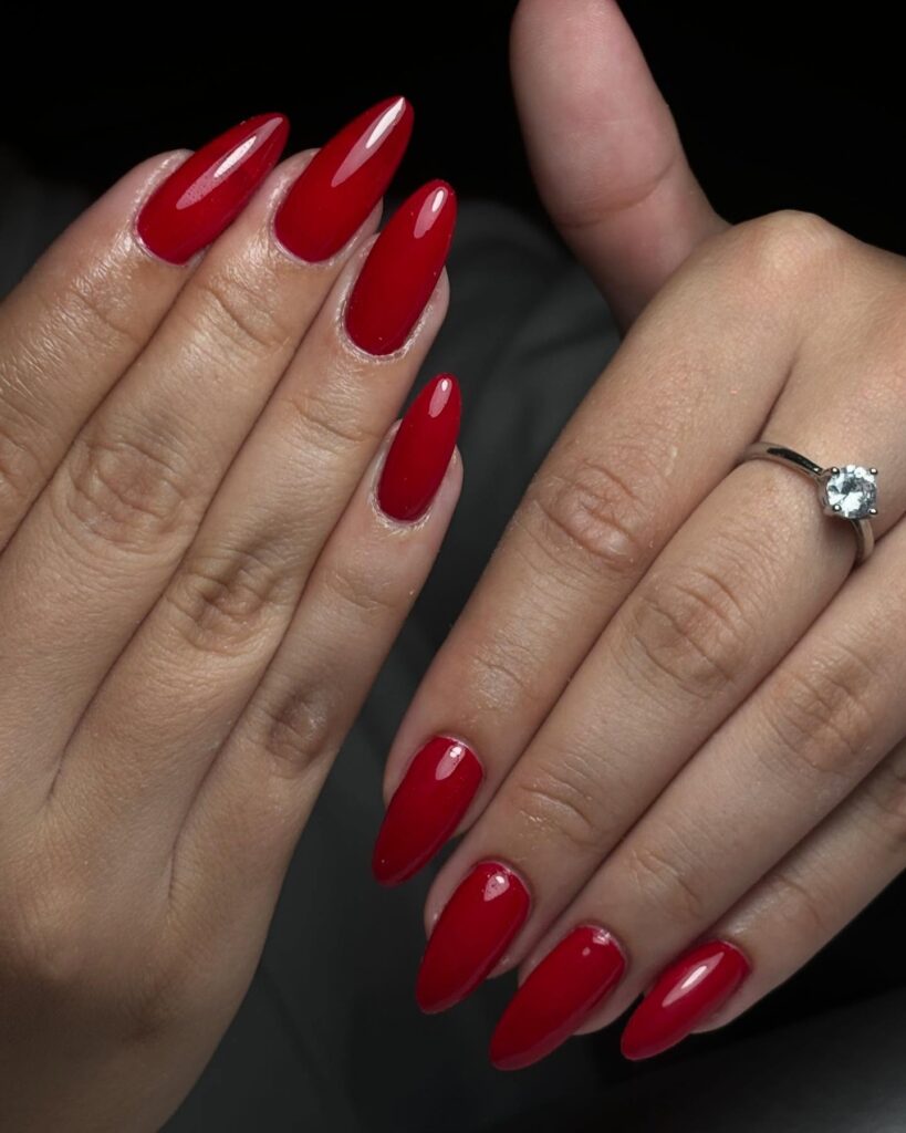 Romantic Almond Red Nails with a Glossy Finish for Sophisticated Evenings