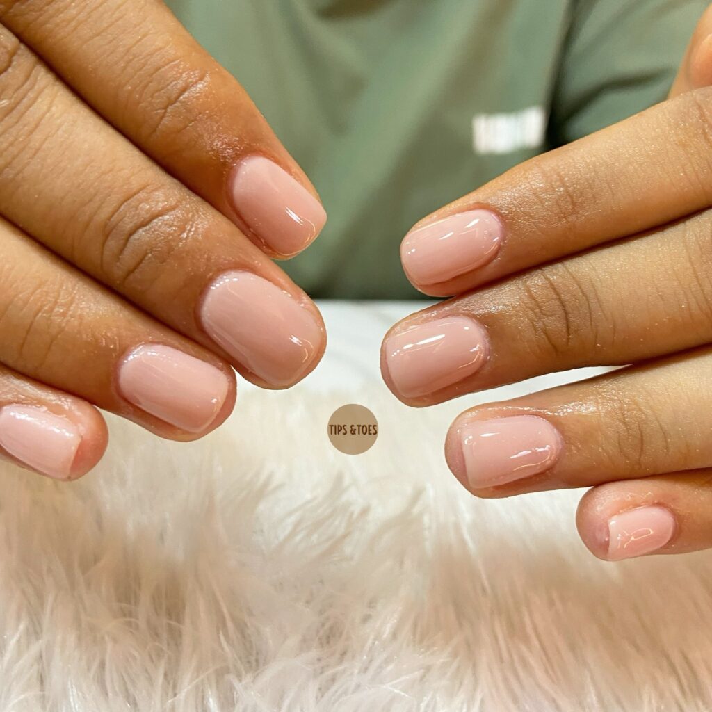 Sheer Nude Pink Rounded Square Nails with High-Gloss Finish for Clean and Minimal Style