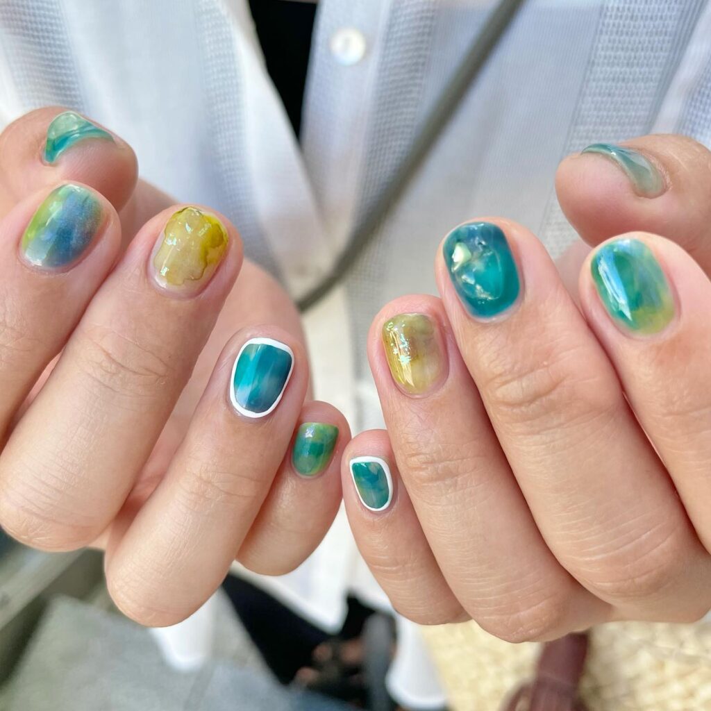 Short Nature-Inspired Nails with Watercolor Green and Teal Hues for a Serene Summer Aesthetic