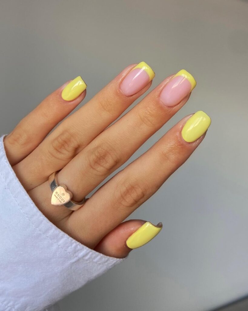 Short lemon yellow square nails with pink accents – fun and bright everyday yellow nail ideas