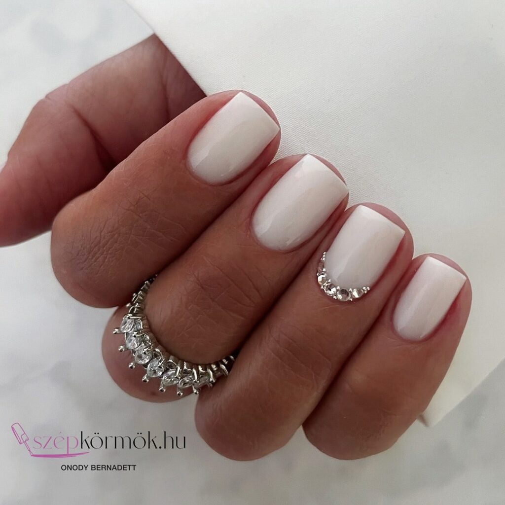 Short Square Nails with Creamy Base and Rhinestone Accents